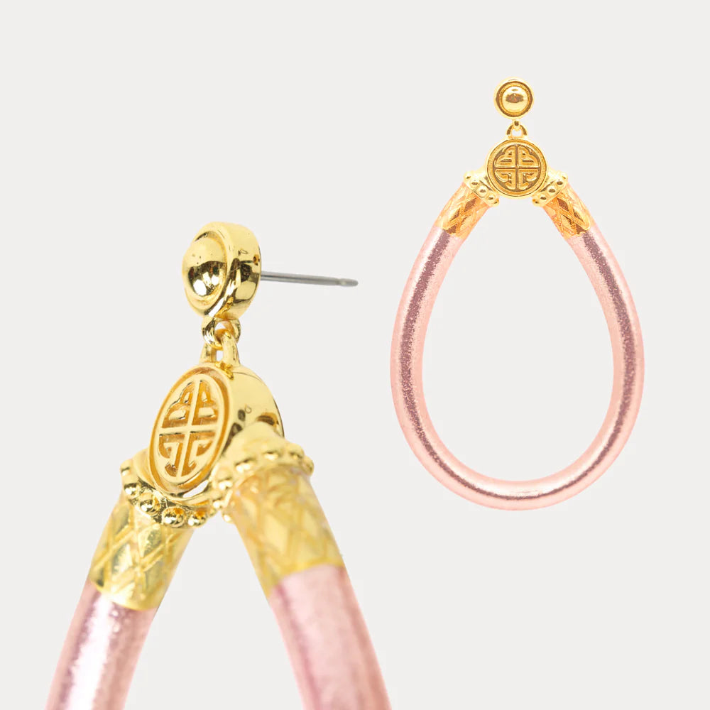 Close up of Budhagirl Gold and rose gold hoop earrings with post back
