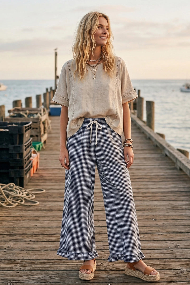 Navy and white gingham pants with ruffled hem