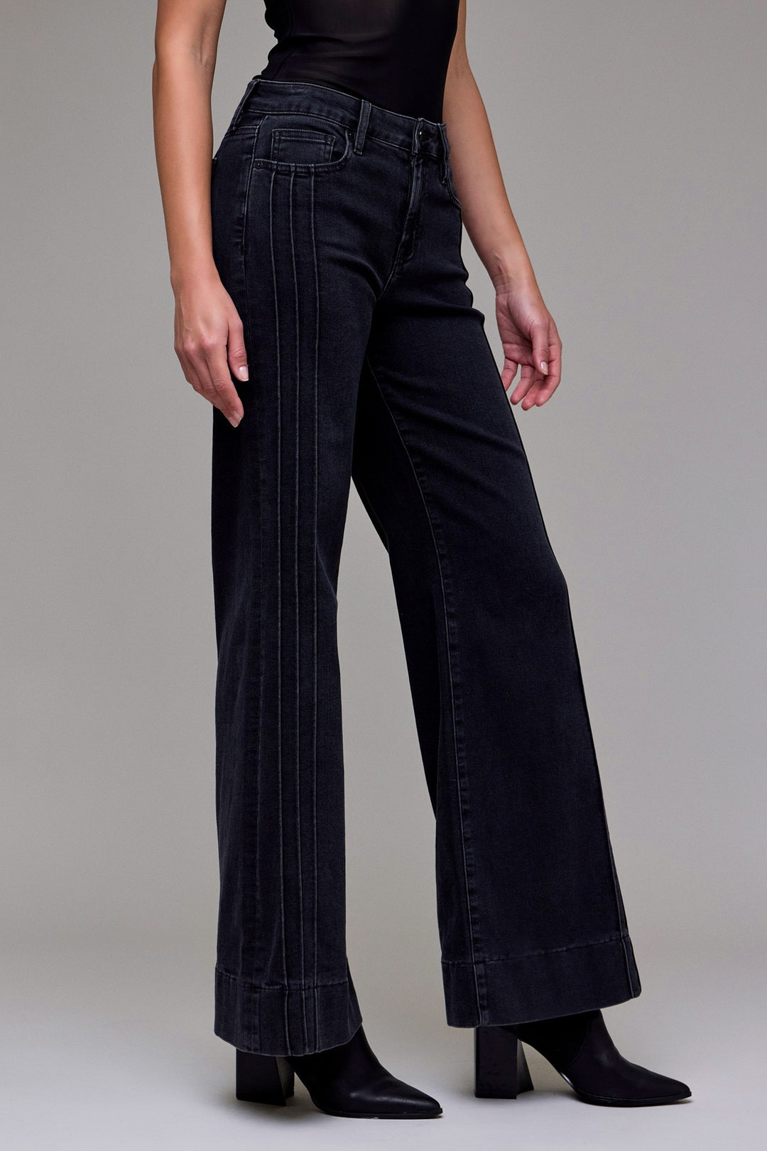 Side angle of Hidden Jeans black denim flare jeans for women