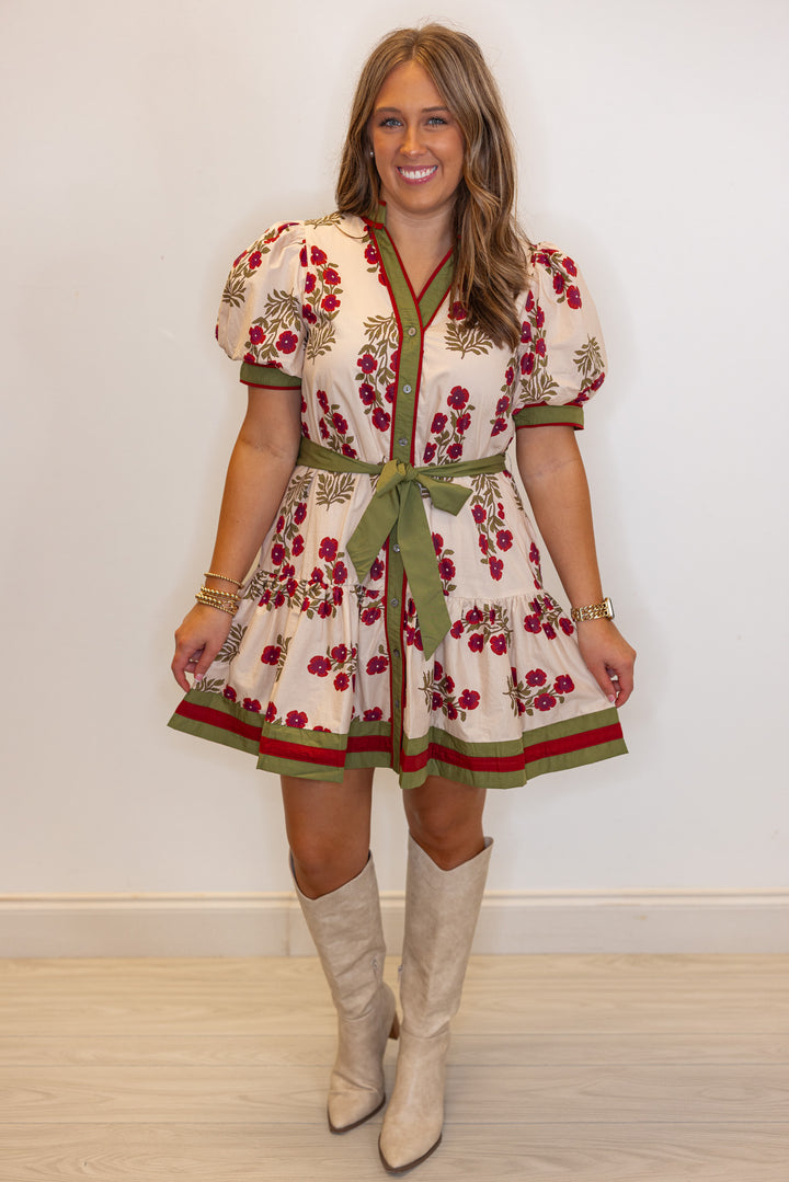 Women's ecru, burgundy and olive floral button down dress with a belted waist by Entro showing ruffled bottom hem