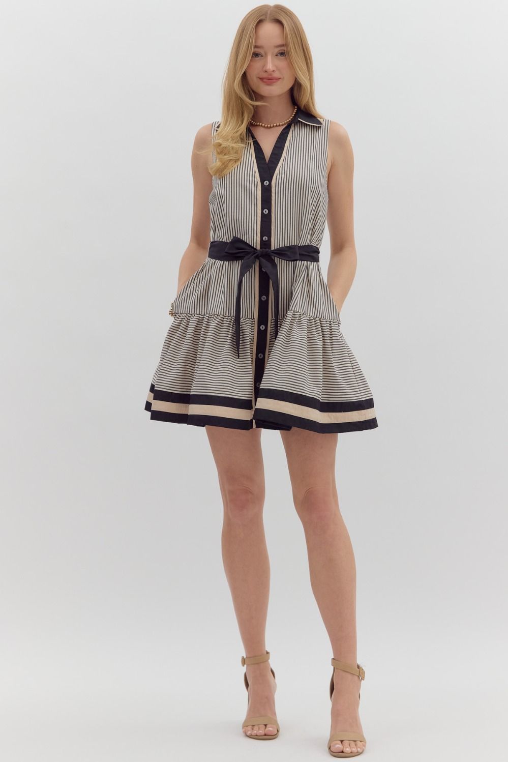 Black and cream striped dress with belted waist by Entro showing full front view