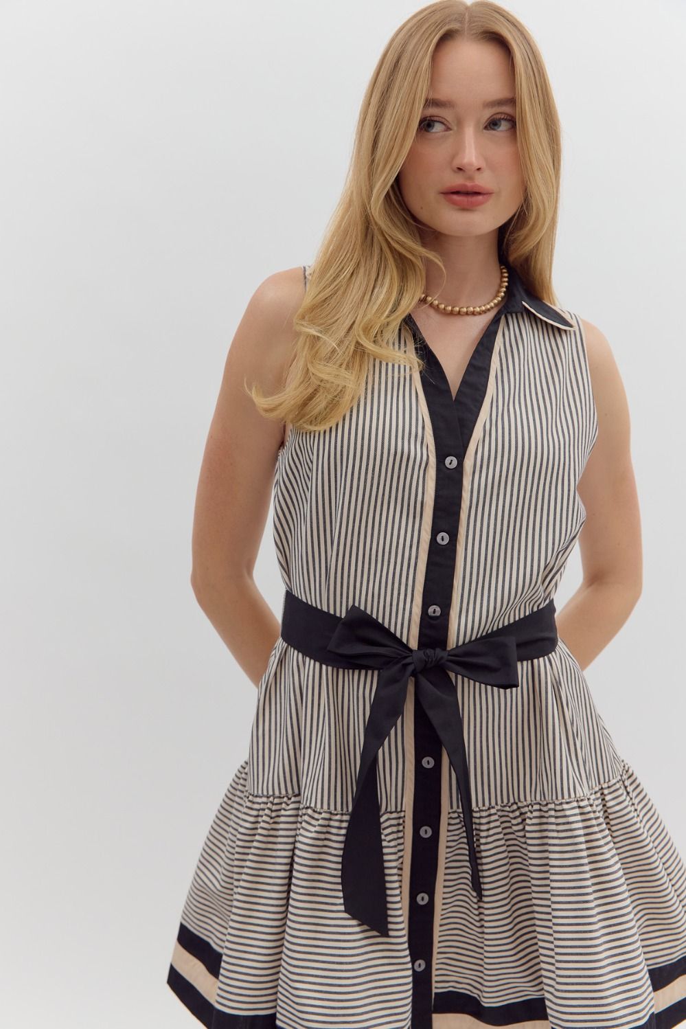Black and cream striped dress with belted waist by Entro