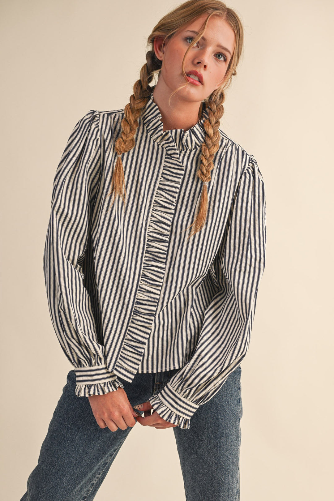 Women's black and cream striped button front top with ruffle trim details by &merci