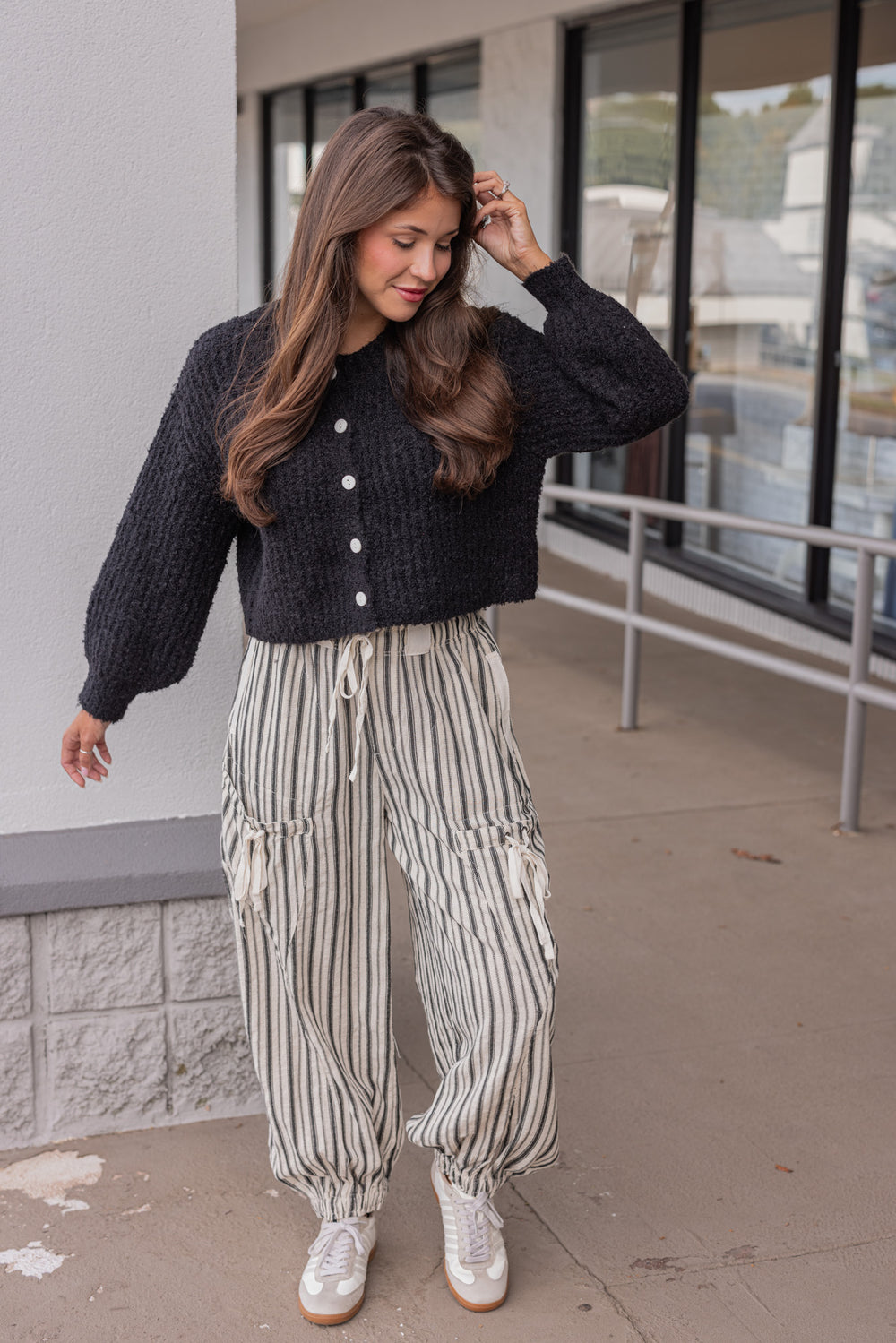 Women's oatmeal linen cargo jogger pants with black stripes by ee:some shown with a casual outfit