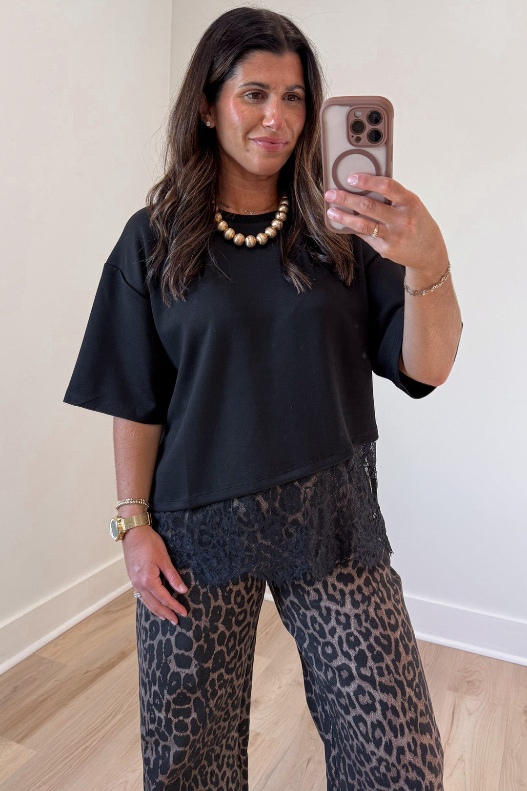 solid black asymmetrical tiered lace hem short sleeve crew neckline top