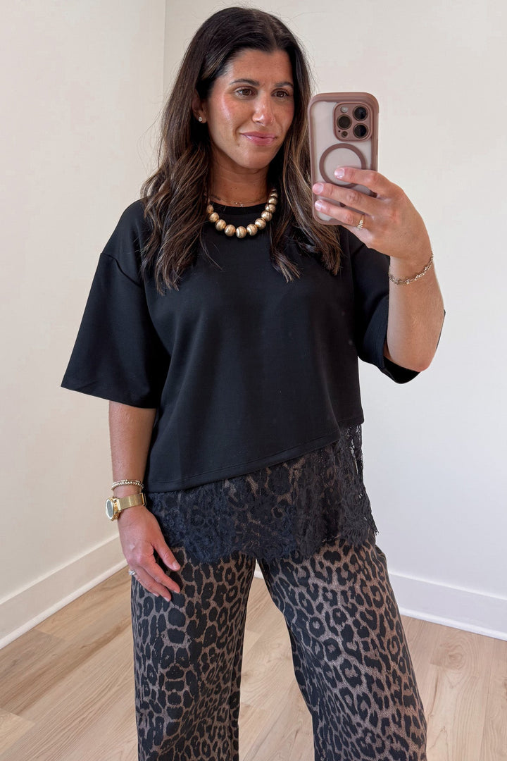 solid black asymmetrical tiered lace hem short sleeve crew neckline top