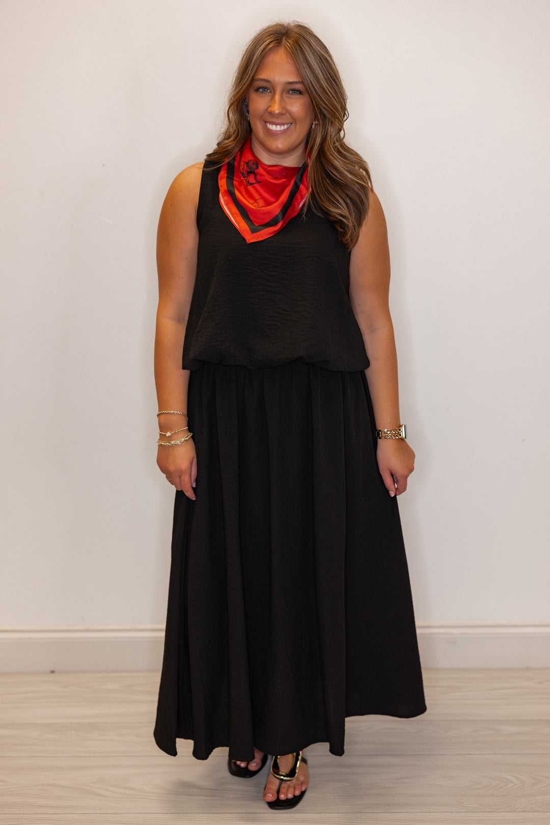 Women's black textured midi skirt with pleats by Entro showing full front view