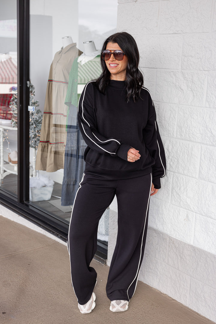 Women's black scuba knit mock neck top by Rae Mode, perfect for cooler weather