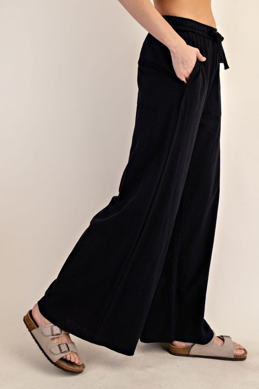Women's black cotton slub knit wide leg pants by Rae Mode showing side view