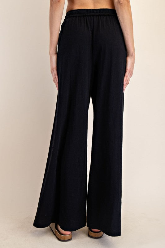 Women's black cotton slub knit wide leg pants by Rae Mode showing back view