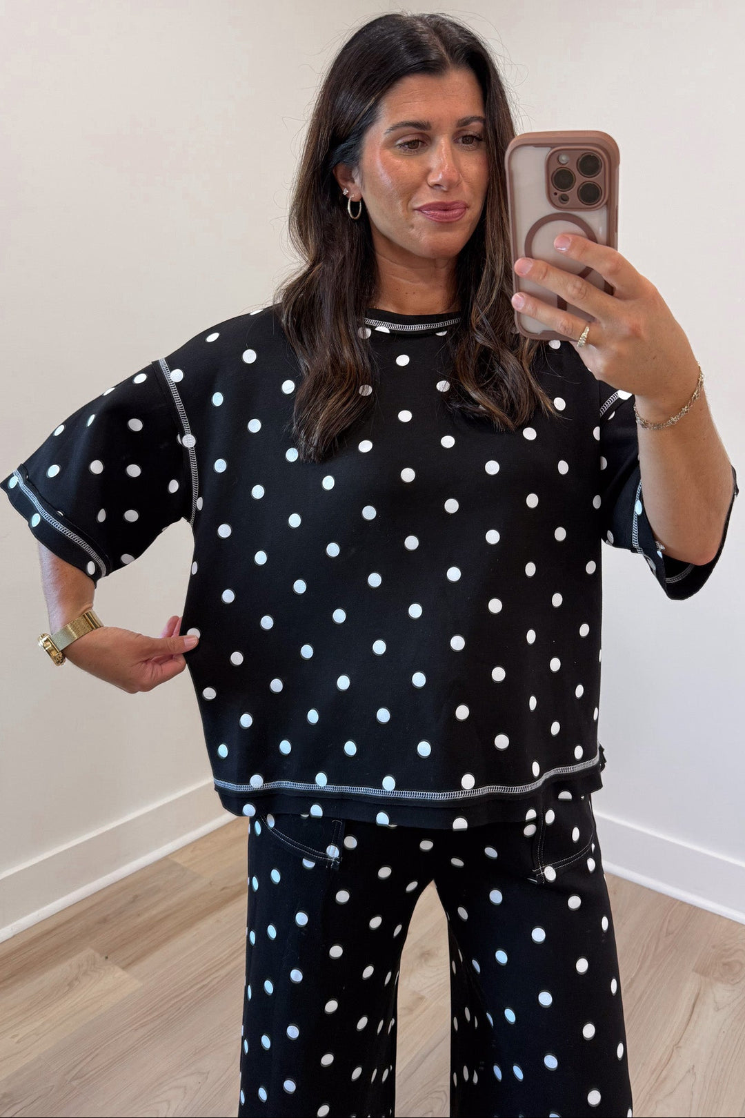 black with white polka dot print relaxed silhouette short sleeve top and pants matching knit set