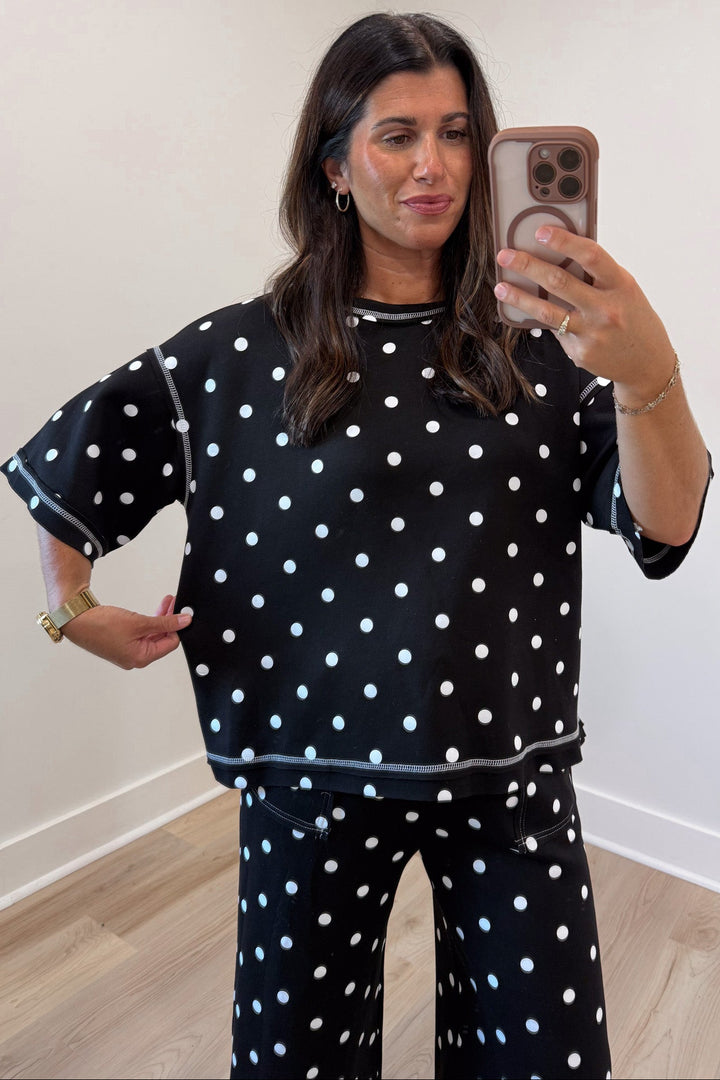 black with white polka dot print relaxed silhouette short sleeve top and pants matching knit set
