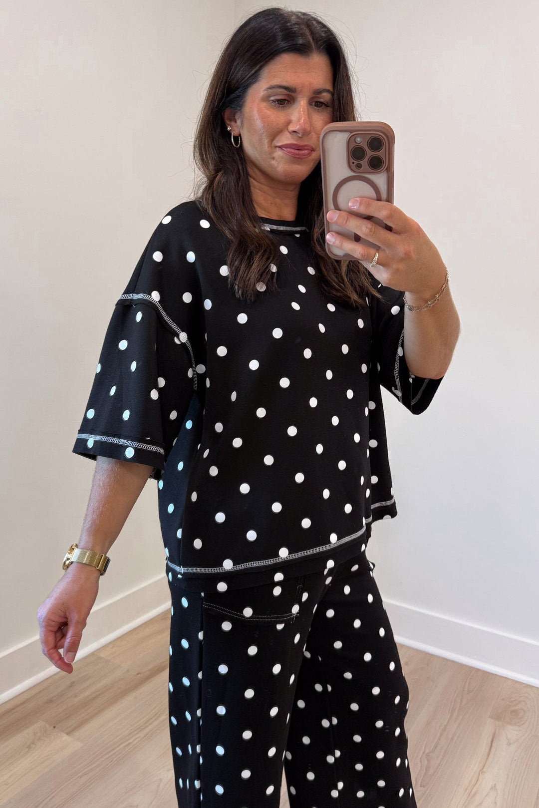 black with white polka dot print relaxed silhouette drop shoulder top and pants matching knit set