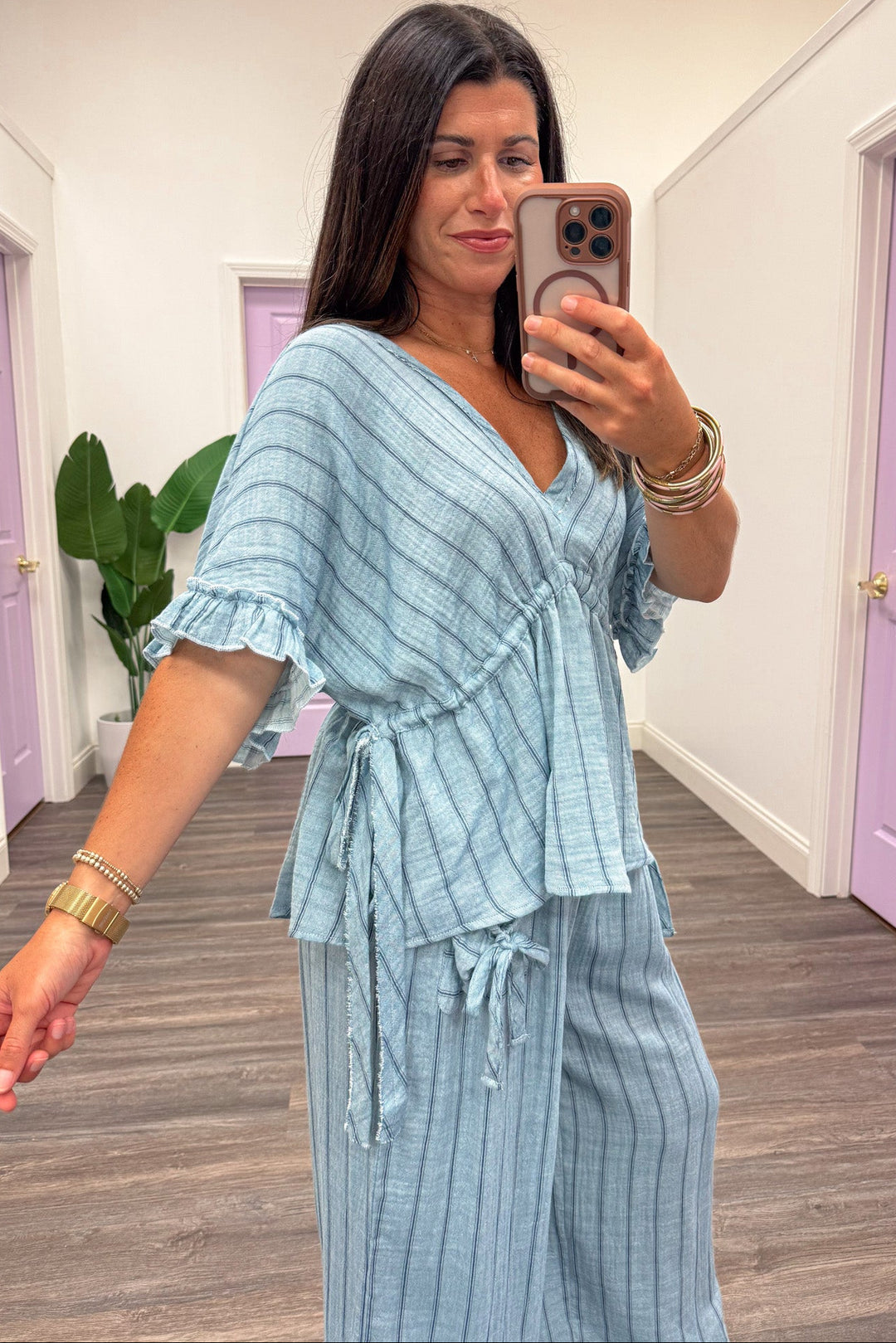 light blue with navy blue stripes drawstring cinch waist ruffle cuffed dolman sleeve top