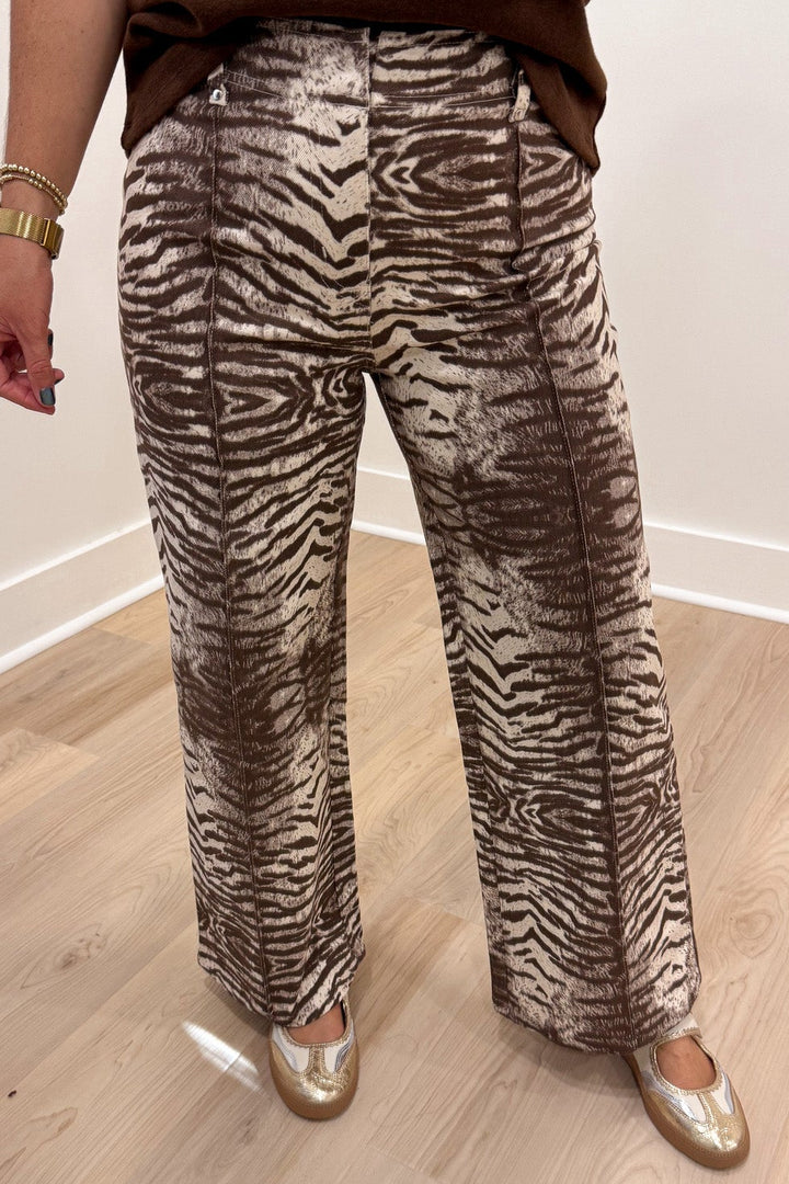 brown and cream zebra print wide leg twill denim pants with pintuck details and hook eye zipper closure