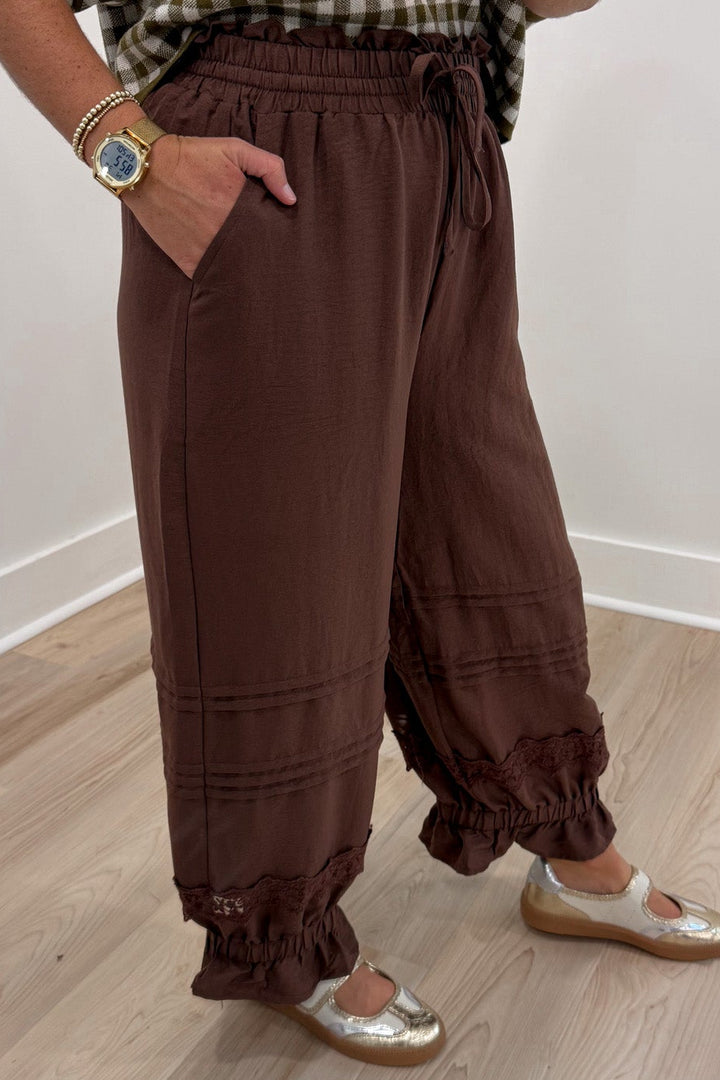 solid brown elastic waist wide leg cropped pants with elastic ruffle cuffed ankles and front pockets