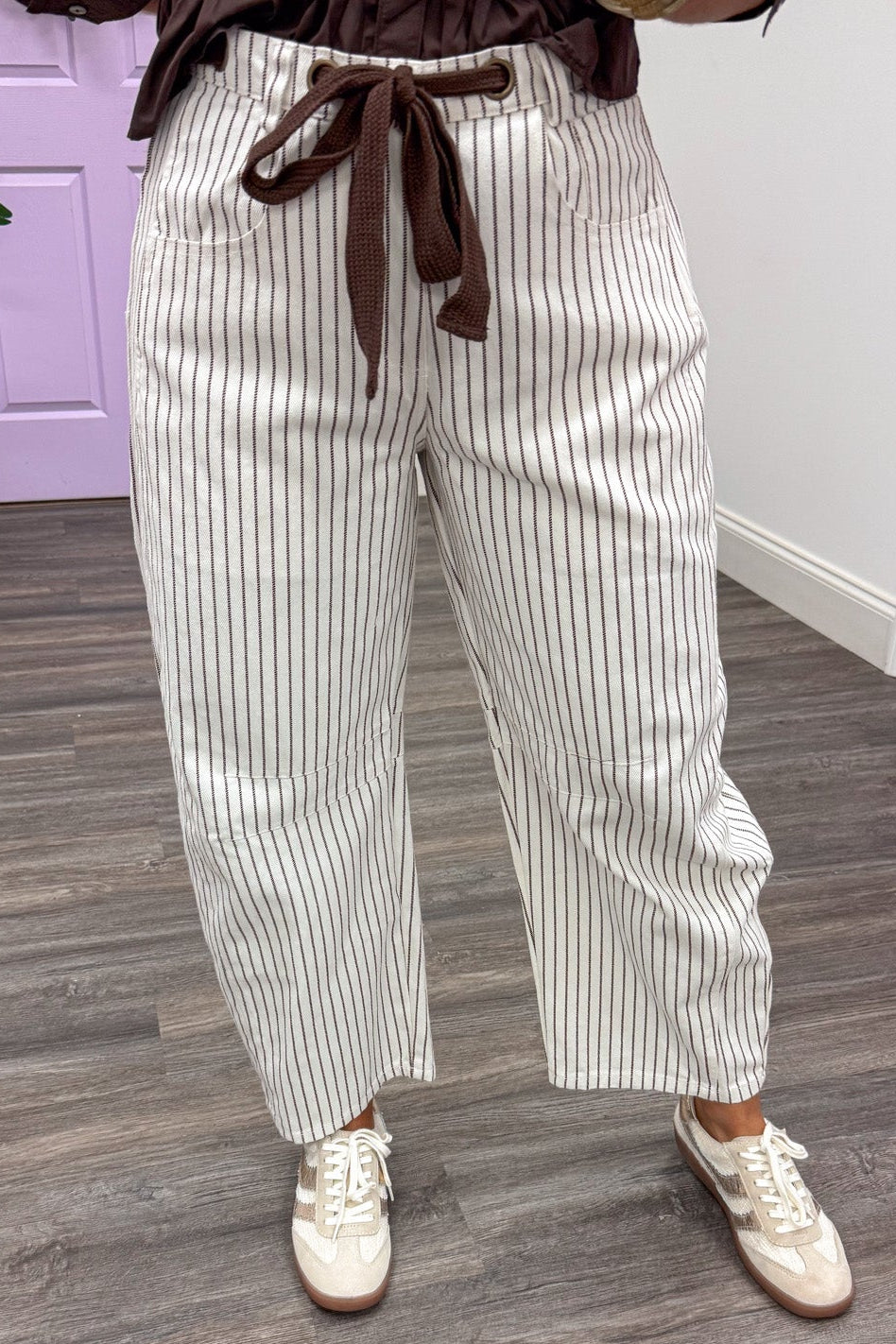 brown and off white striped wide barrel leg denim pants with button/zipper and drawstring closure