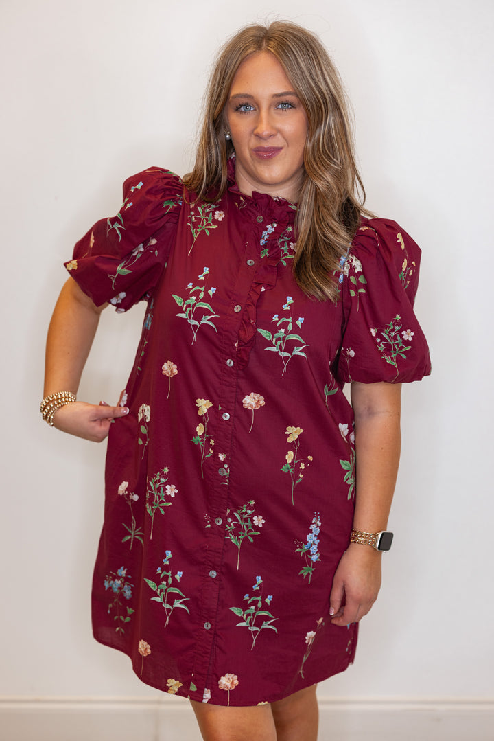 Women's burgundy multicolor floral print button front poplin dress with ruffle detail by Entro showing true to size fit