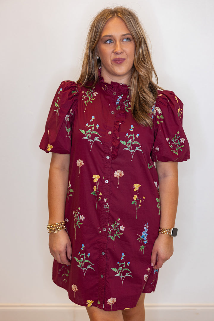 Women's burgundy multicolor floral print button front poplin dress with ruffle detail by Entro showing up close, front view