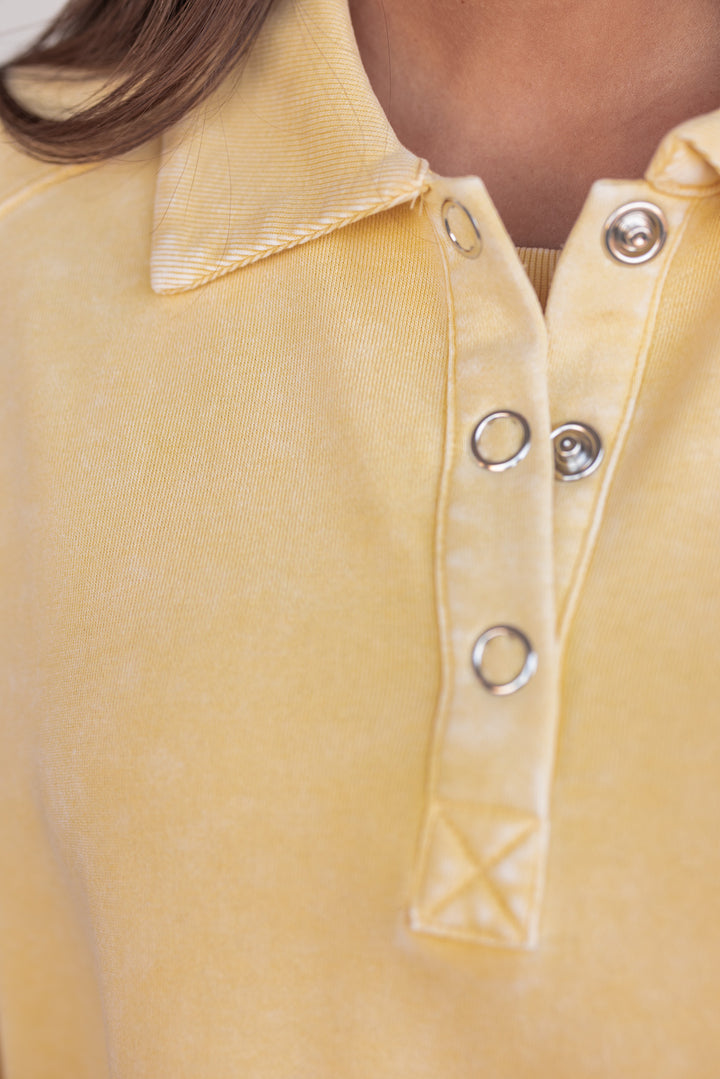 butter yellow button neckline pullover top detail 
