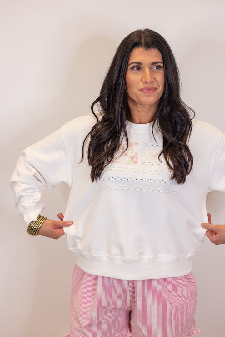 white pastel floral flag sweatshirt