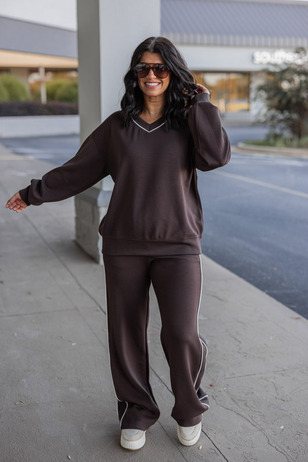 Women's chocolate brown scuba knit straight leg elastic waist pants by Rae Mode showing full front view