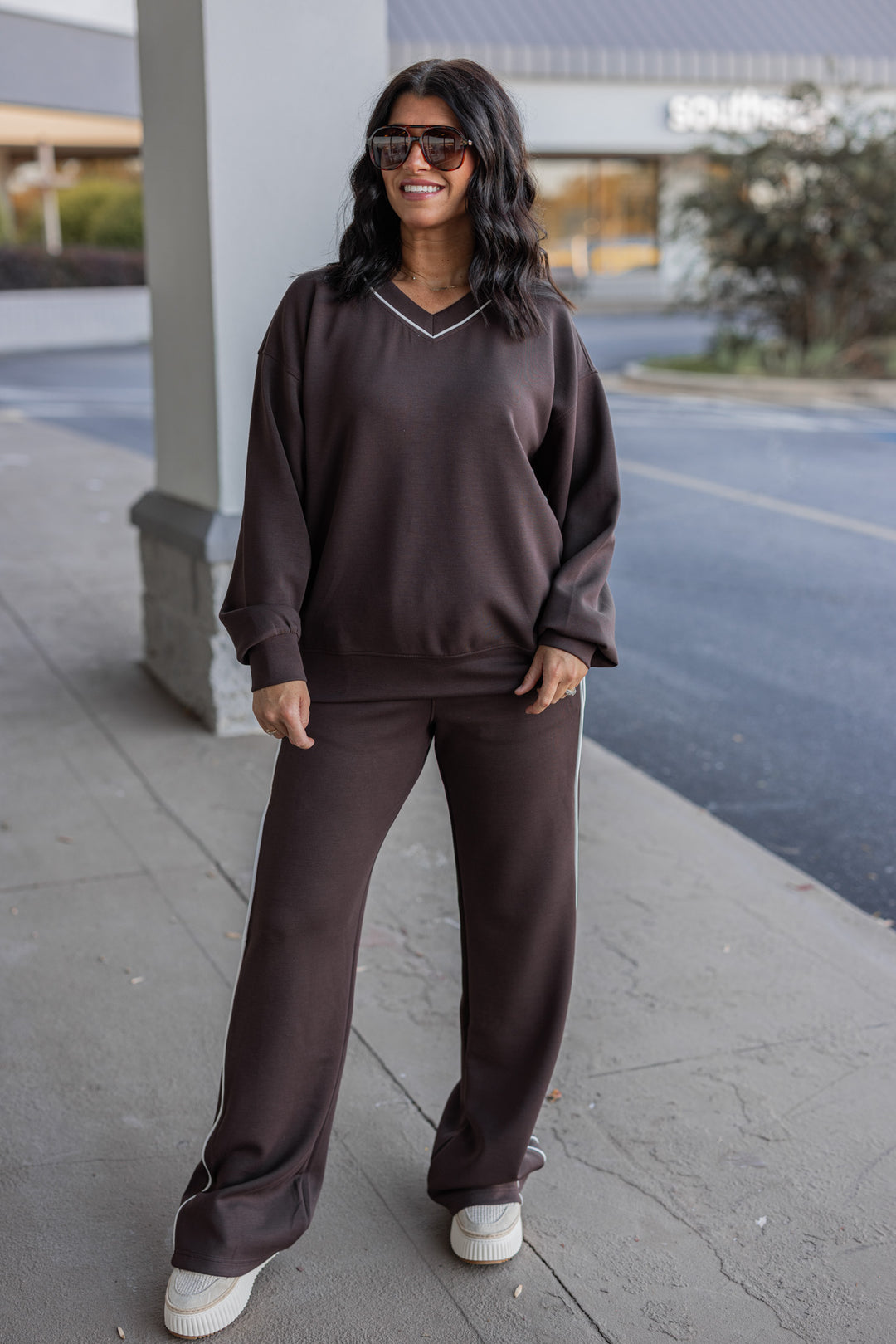 Women's chocolate brown scuba knit straight leg elastic waist pants by Rae Mode shown with matching top