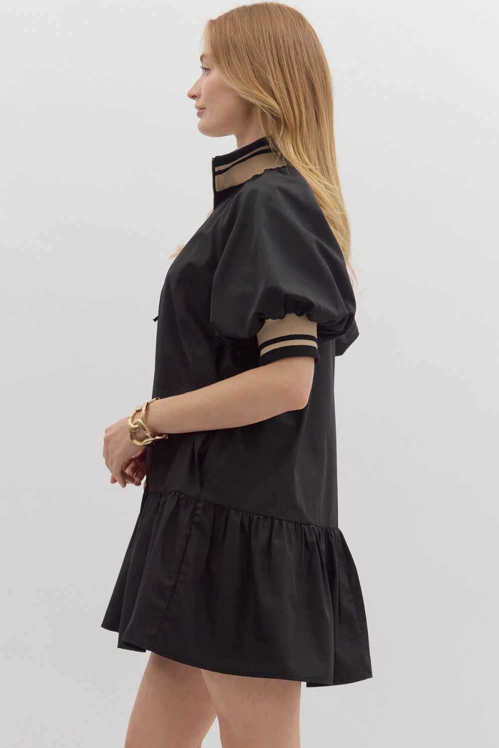 Women's black zipper dress with black and tan ribbed trim by Entro showing side view