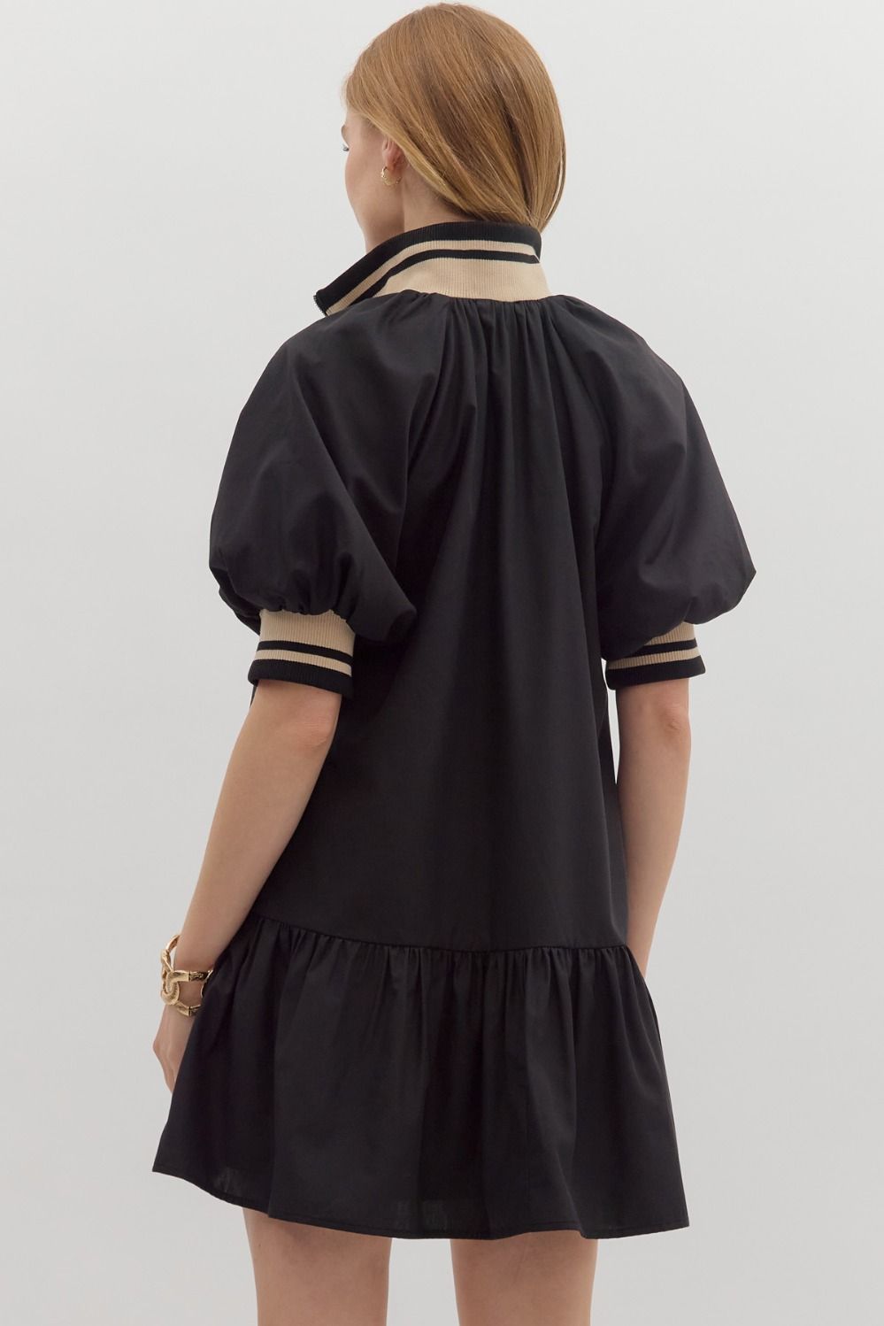 Women's black zipper dress with black and tan ribbed trim by Entro showing back view