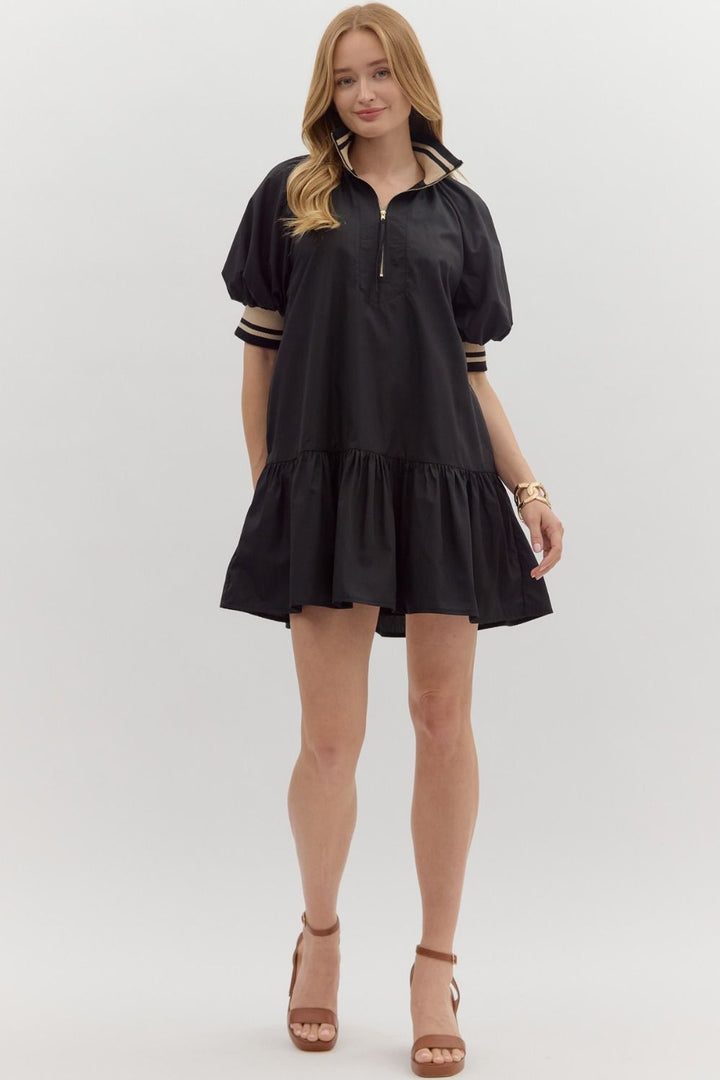 Women's black zipper dress with black and tan ribbed trim by Entro showing full front view