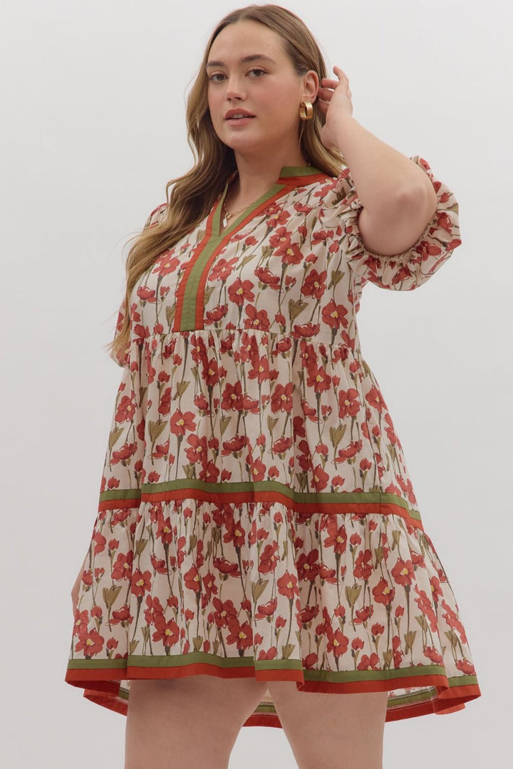 Cream tiered dress with rusted burgundy and olive floral print by Entro in Plus showing slight side view