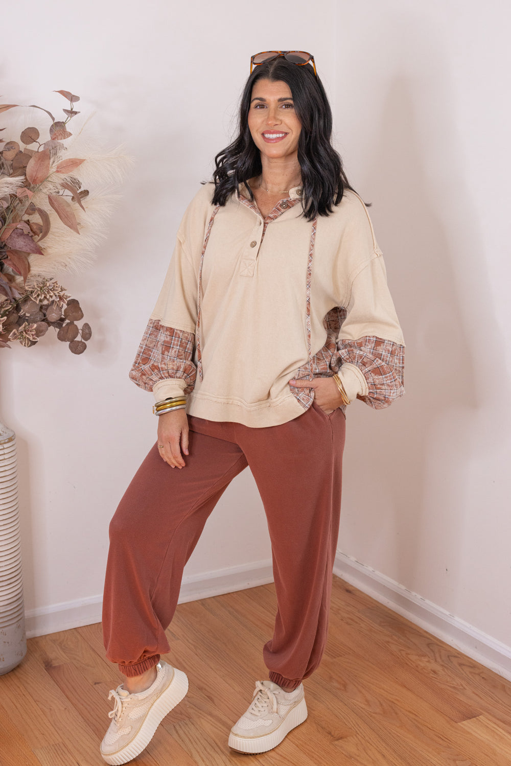 Women's beige french terry knit hooded top with plaid patchwork colorblock by Easel showing slightly angled front view