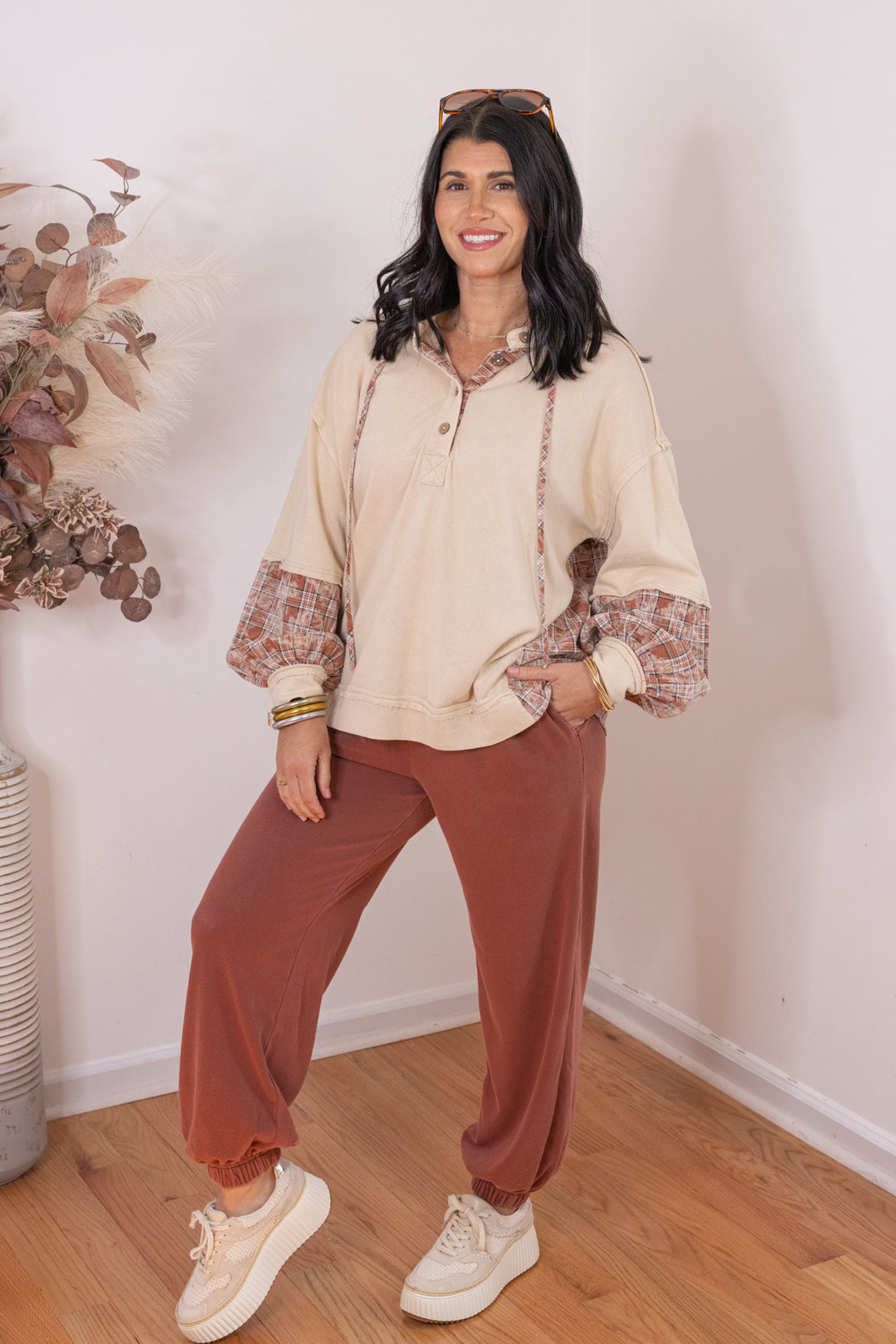 Women's beige french terry knit hooded top with plaid patchwork colorblock by Easel showing slightly angled front view