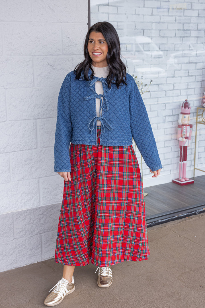 Women's blue denim quilted jacket with bow tie front closure by She + Sky showing full front view