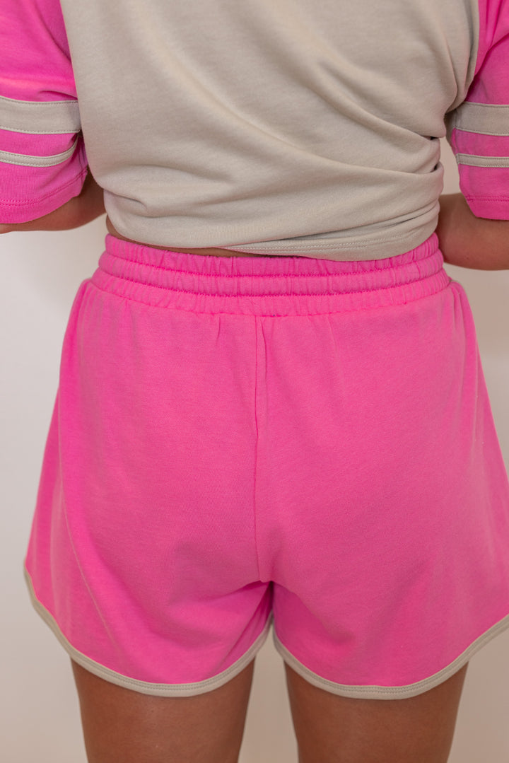 Women's light mocha and punch pink terry knit colorblock top and shorts set by Wishlist showing up close back view of shorts