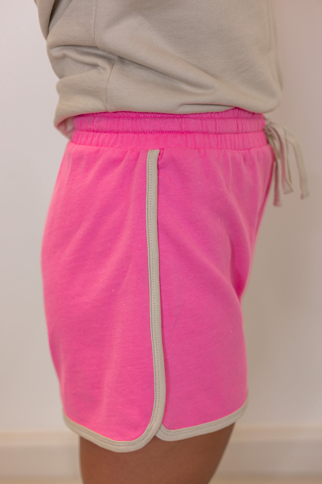 Women's light mocha and punch pink terry knit colorblock top and shorts set by Wishlist showing up close side view of shorts