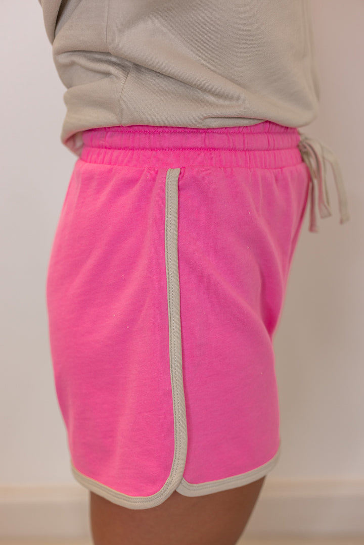 Women's light mocha and punch pink terry knit colorblock top and shorts set by Wishlist showing up close side view of shorts