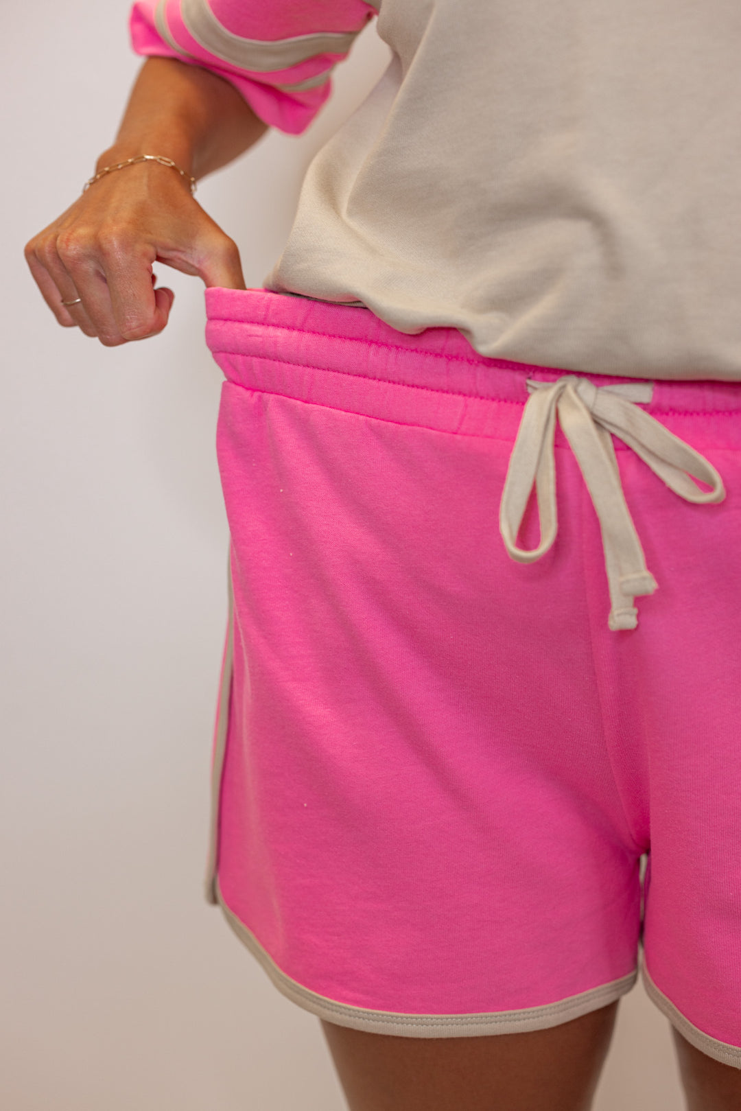 Women's light mocha and punch pink terry knit colorblock top and shorts set by Wishlist showing shorts elastic waistband