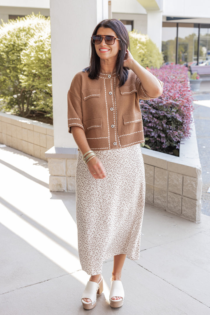 Women's caramel button front sweater cardigan with cream stitching detail by Entro, perfect for the office