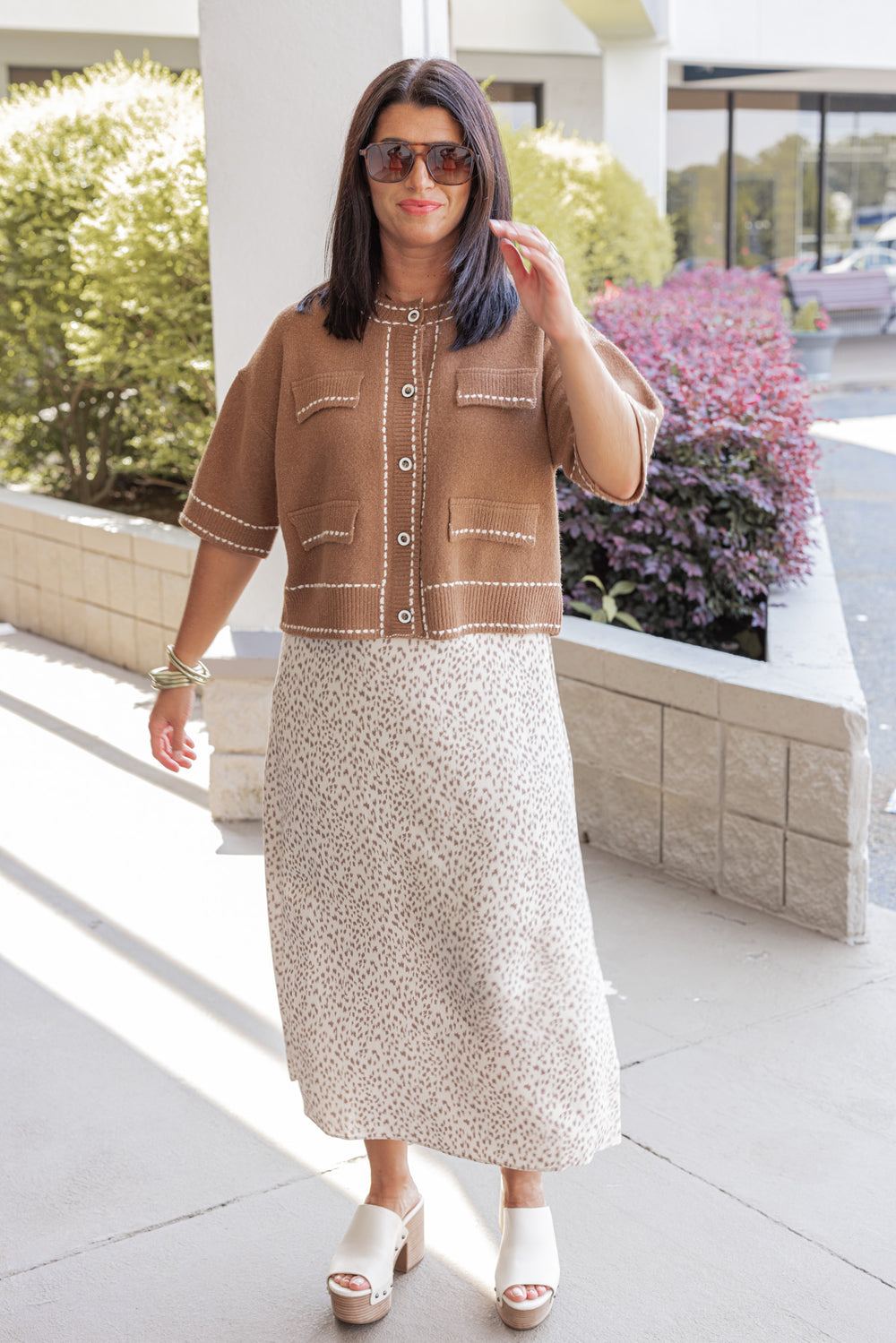 Women's caramel button front sweater cardigan with cream stitching detail by Entro showing full front view