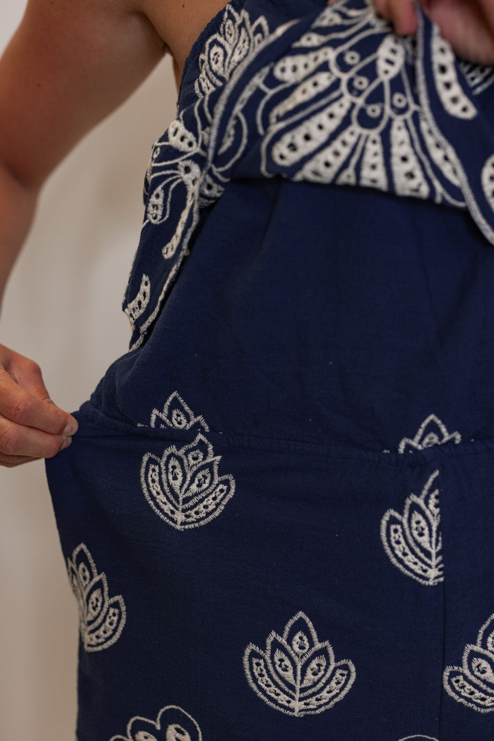 Women's navy halter romper with cream eyelet details by Illa Illa showing up close waistband stretch