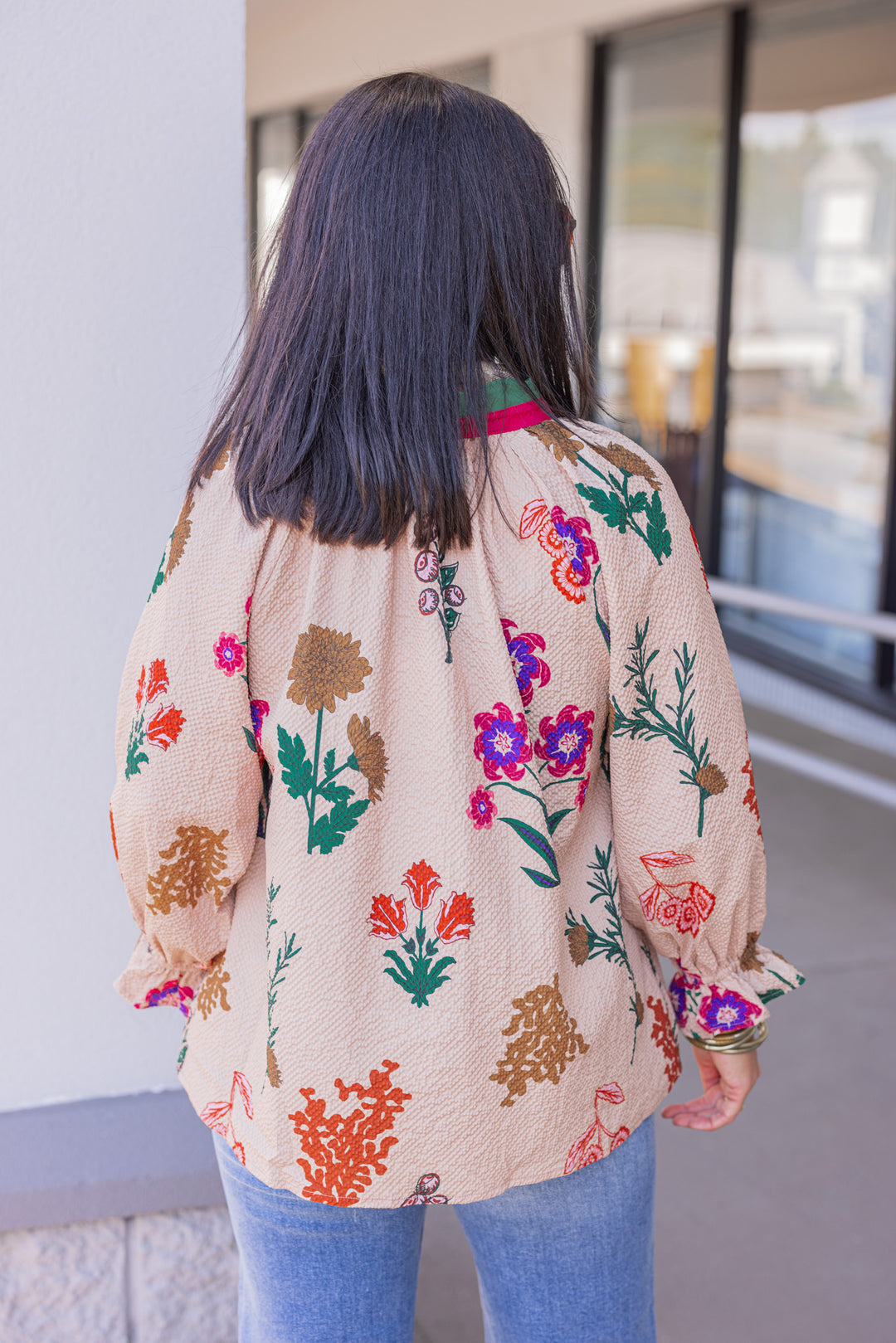 Women's tan textured floral print top with button details by Umgee showing back view