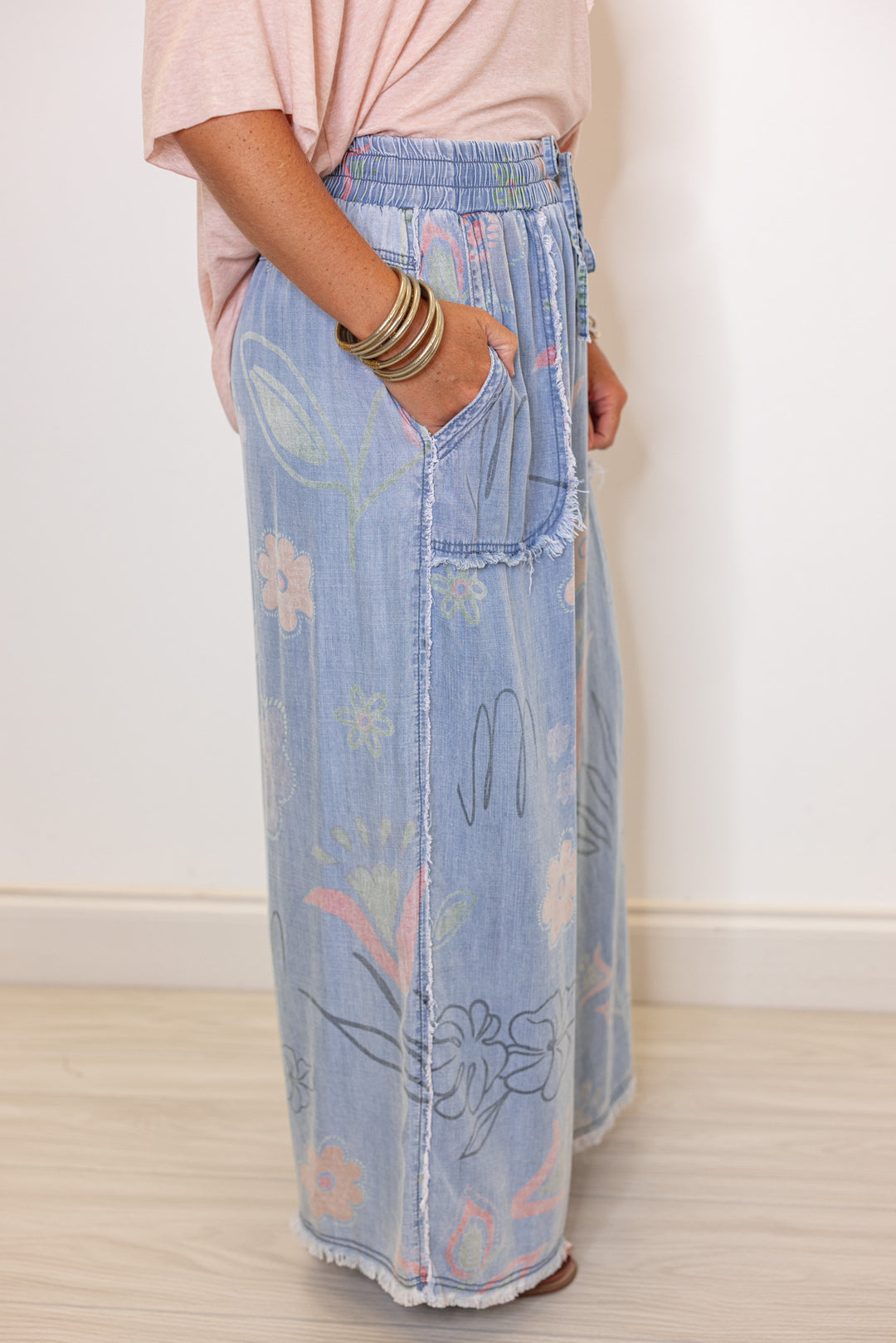 Women's washed light blue floral print wide leg palazzo chambray denim pants by Easel showing up close side view