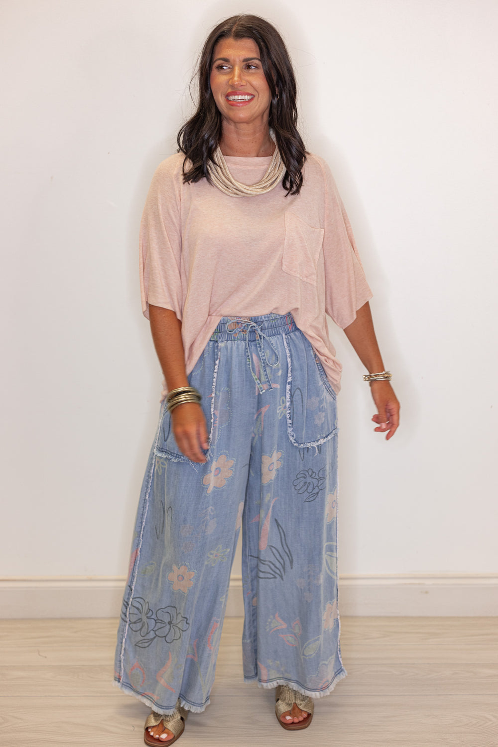 Women's washed light blue floral print wide leg palazzo chambray denim pants by Easel showing full front view