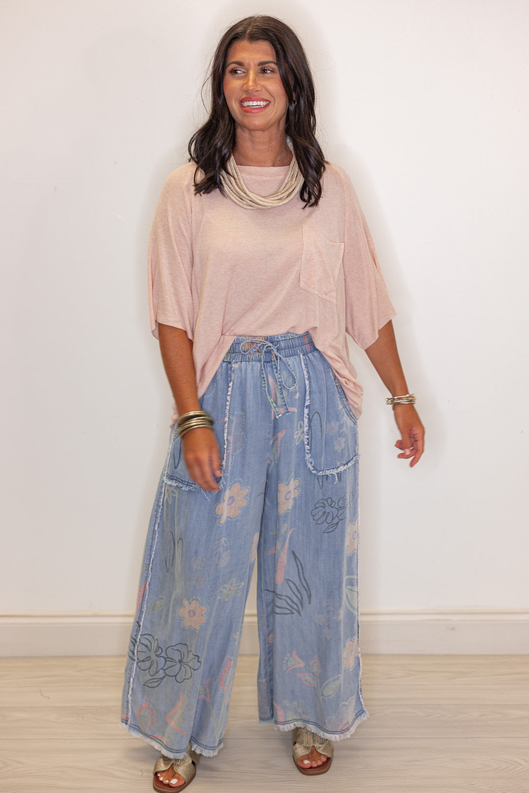 Women's washed light blue floral print wide leg palazzo chambray denim pants by Easel showing full front view