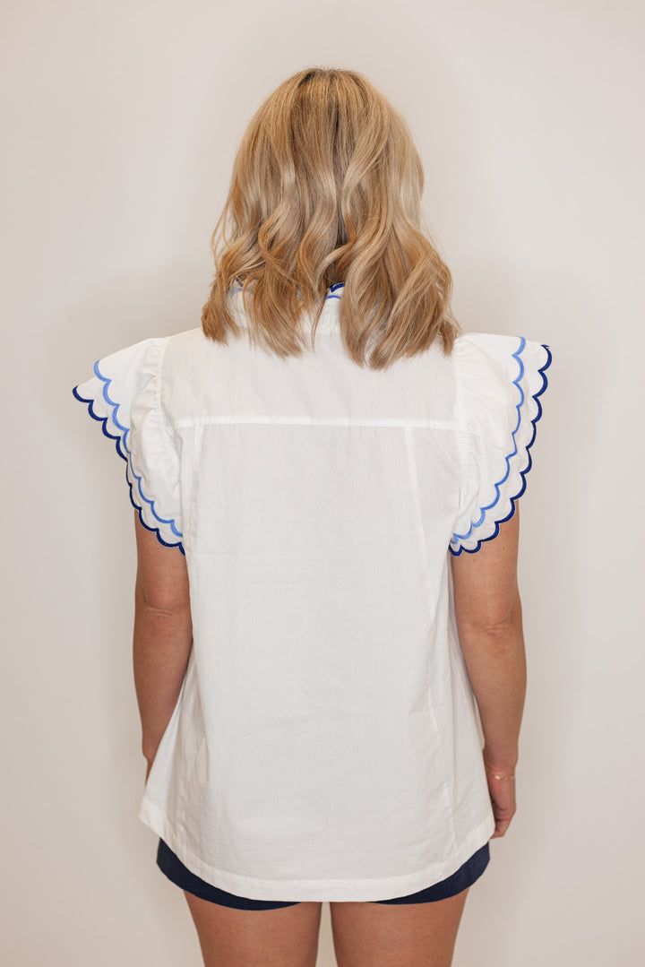 Women's summer off white poplin top with blue and navy scalloped trim by Umgee showing back view