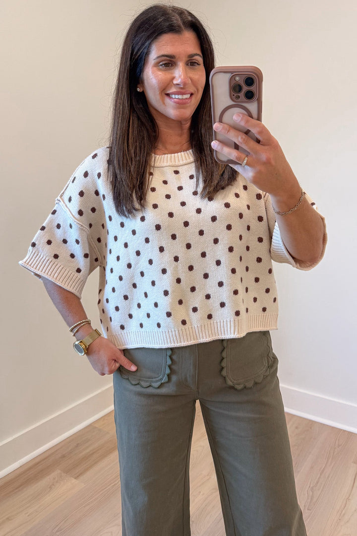 ecru with brown polka dot print half-length sleeve semi-cropped knit top with reverse seam details