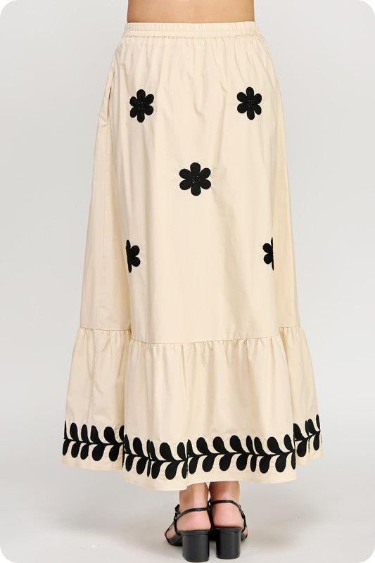 Women's poplin Summer maxi skirt in ecru with black floral print shown in back view