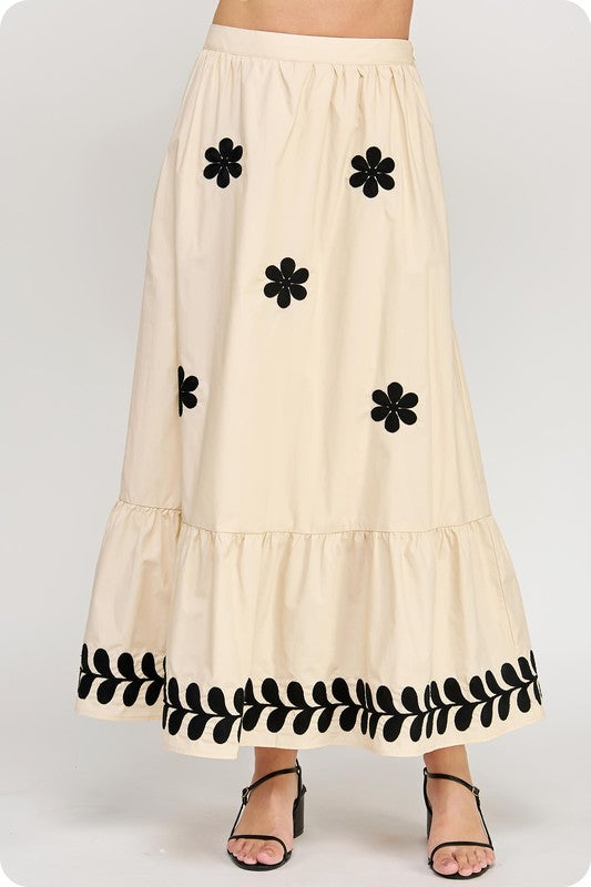 Women's poplin Summer maxi skirt in ecru with black floral print shown in up close view