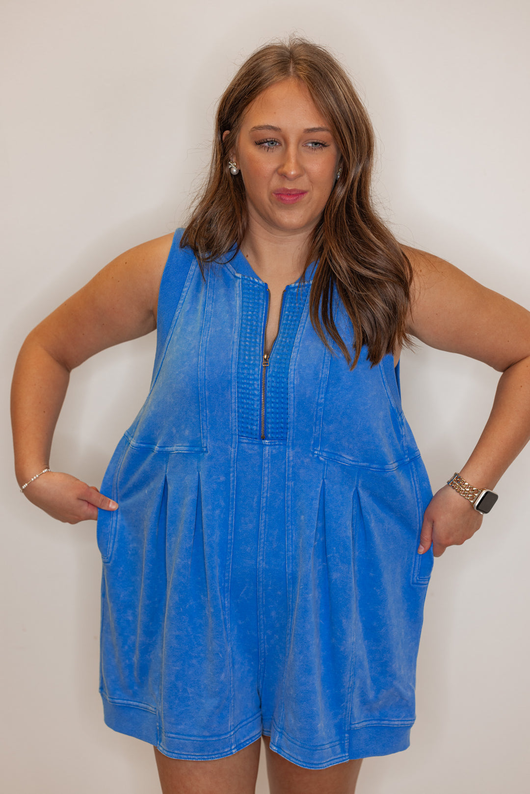 Women's blue french terry knit wide leg zip romper by Veveret showing material stretch